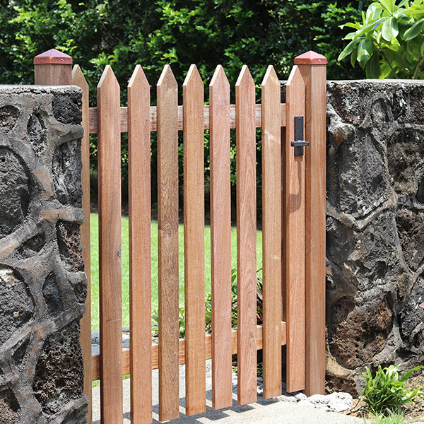 image of rock wall with wooden gate